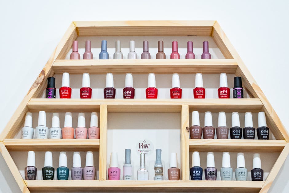A vibrant selection of nail polish bottles arranged on a wooden hexagonal shelf in Buenos Aires.